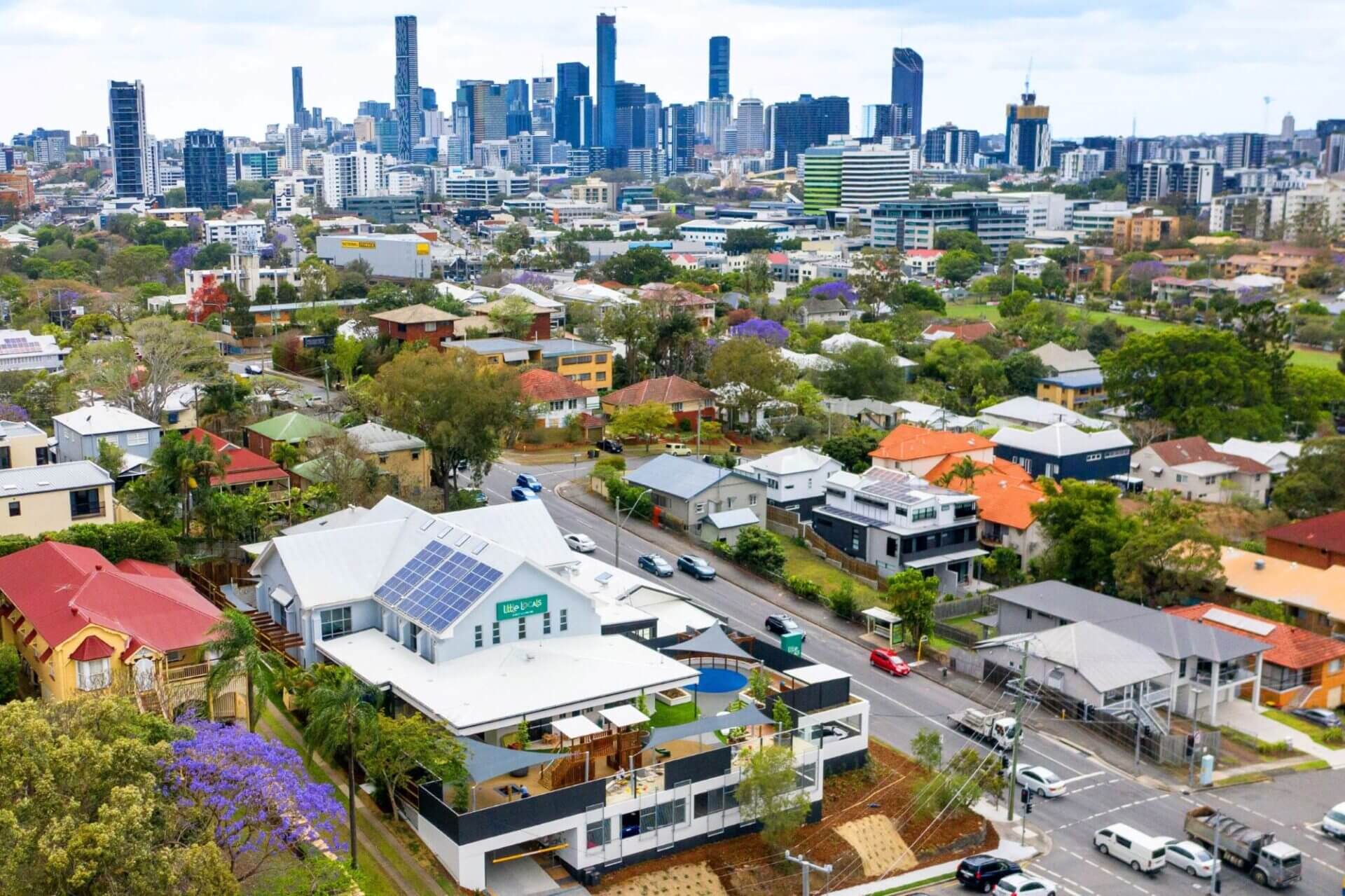 An aerial view of Little Locals Early Learning Centres' Auchenflower centre with Brisbane City in the background.